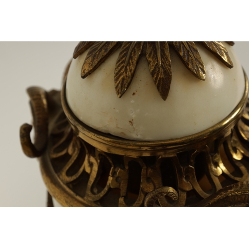 562 - A PAIR OF 19TH CENTURY CARRARA MARBLE AND ORMOLU MOUNTED CASOLETTES with detachable finials, peirced... 