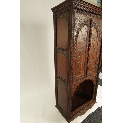 175 - AN EARLY 19TH CENTURY ANGLO-INDIAN HARDWOOD SIDE CABINET with panelled sides and detailed carved dec... 