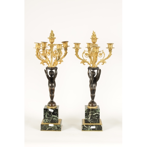 588 - A FINE PAIR OF LATE 19TH CENTURY BRONZE AND ORMOLU FRENCH EMPIRE STYLE FOUR BRANCH CANDELABRA the gi... 