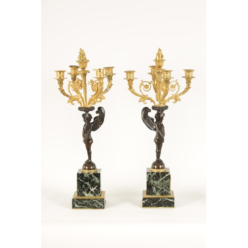 588 - A FINE PAIR OF LATE 19TH CENTURY BRONZE AND ORMOLU FRENCH EMPIRE STYLE FOUR BRANCH CANDELABRA the gi... 