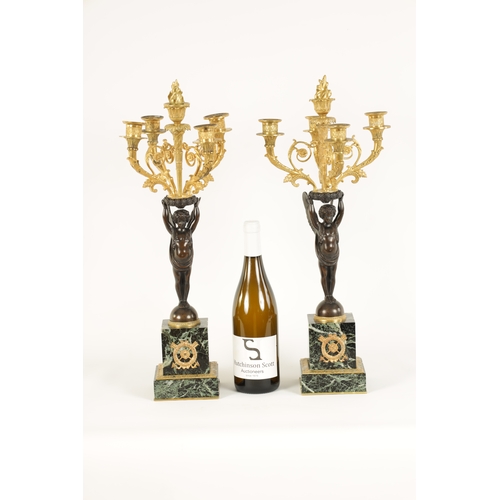 588 - A FINE PAIR OF LATE 19TH CENTURY BRONZE AND ORMOLU FRENCH EMPIRE STYLE FOUR BRANCH CANDELABRA the gi... 