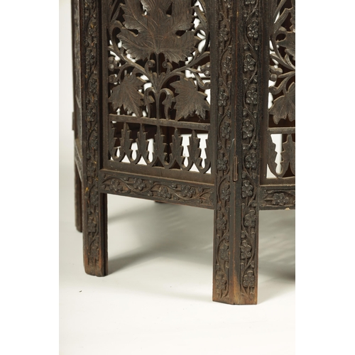 100 - A 19TH CENTURY CARVED HARDWOOD ANGLO INDIAN FOLDING OCCASIONAL TABLE - PROBABLY BURMESE with finely ... 