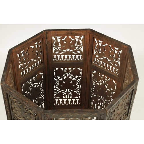 100 - A 19TH CENTURY CARVED HARDWOOD ANGLO INDIAN FOLDING OCCASIONAL TABLE - PROBABLY BURMESE with finely ... 