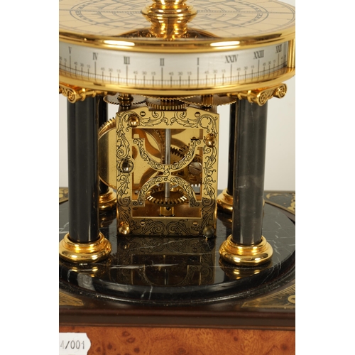 1005 - A ROYAL GEOGRAPHICAL SOCIETY MILLENNIUM CLOCK having a rotating cobalt blue glass globe and moon wit... 