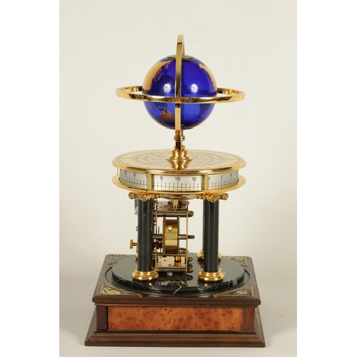 1005 - A ROYAL GEOGRAPHICAL SOCIETY MILLENNIUM CLOCK having a rotating cobalt blue glass globe and moon wit... 