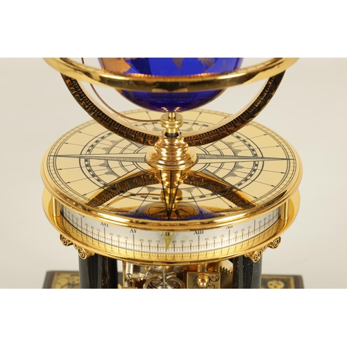 1005 - A ROYAL GEOGRAPHICAL SOCIETY MILLENNIUM CLOCK having a rotating cobalt blue glass globe and moon wit... 