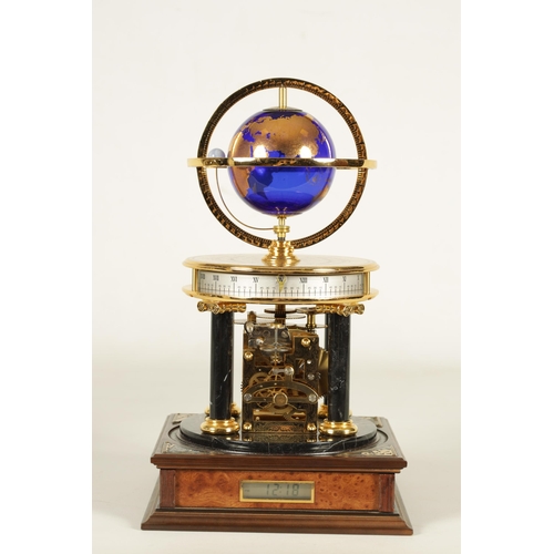 1005 - A ROYAL GEOGRAPHICAL SOCIETY MILLENNIUM CLOCK having a rotating cobalt blue glass globe and moon wit... 