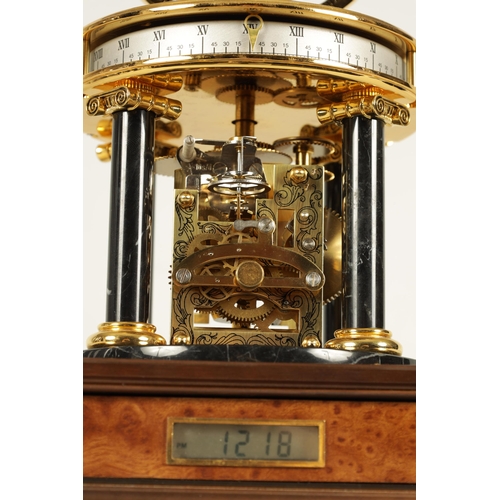 1005 - A ROYAL GEOGRAPHICAL SOCIETY MILLENNIUM CLOCK having a rotating cobalt blue glass globe and moon wit... 