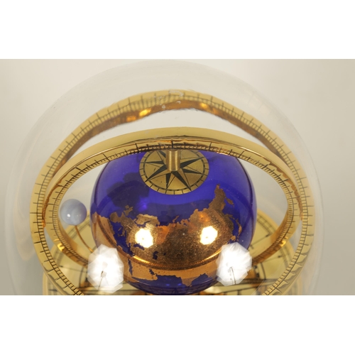 1005 - A ROYAL GEOGRAPHICAL SOCIETY MILLENNIUM CLOCK having a rotating cobalt blue glass globe and moon wit... 