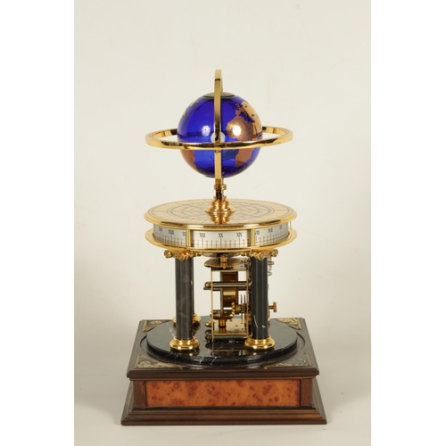 1005 - A ROYAL GEOGRAPHICAL SOCIETY MILLENNIUM CLOCK having a rotating cobalt blue glass globe and moon wit... 