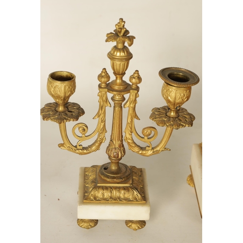 1006 - A 19TH CENTURY FRENCH ORMOLU AND WHITE MARBLE CLOCK GARNITURE the 4