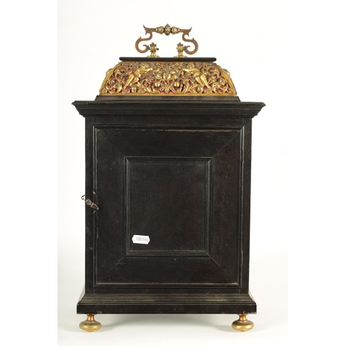 1009 - A 17TH CENTURY STYLE CONTINENTAL EBONY VENEERED AND GILT BRASS MOUNTED BASKET TOP BRACKET CLOCK the ... 