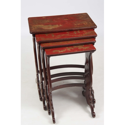 102 - A SET OF 19TH CENTURY SCARLET LACQUER CHINOISERIE DECORATED NEST OF TABLES comprising four graduated... 