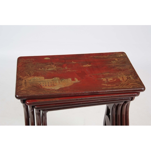 102 - A SET OF 19TH CENTURY SCARLET LACQUER CHINOISERIE DECORATED NEST OF TABLES comprising four graduated... 