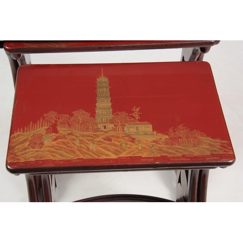 102 - A SET OF 19TH CENTURY SCARLET LACQUER CHINOISERIE DECORATED NEST OF TABLES comprising four graduated... 