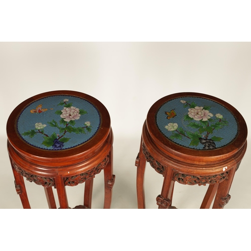 103 - A PAIR OF LATE 19TH/EARLY 20TH CENTURY HARDWOOD CHINESE JARDINIERE STANDS WITH CLOISONN ENAMEL TOPS... 