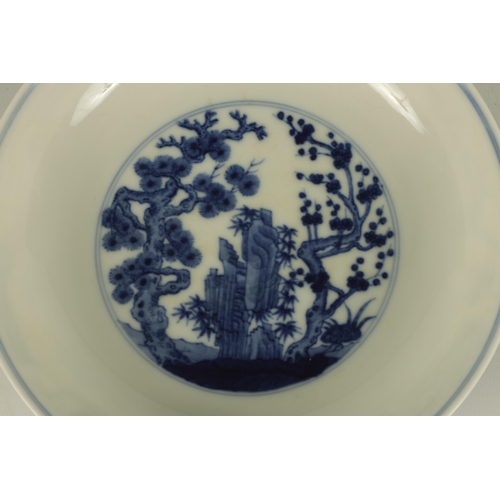 105 - A LATE 19TH CENTURY CHING DYNASTY CHINESE BLUE AND WHITE BOWL decorated with an outer fenced garden ... 