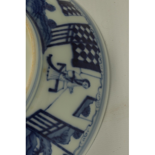 105 - A LATE 19TH CENTURY CHING DYNASTY CHINESE BLUE AND WHITE BOWL decorated with an outer fenced garden ... 