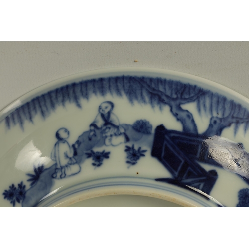 105 - A LATE 19TH CENTURY CHING DYNASTY CHINESE BLUE AND WHITE BOWL decorated with an outer fenced garden ... 