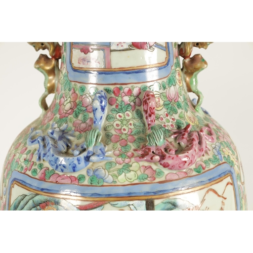 107 - TWO LATE 19TH CENTURY CHINESE FAMILLE ROSE PORCELAIN VASES of baluster form with scenic panels among... 