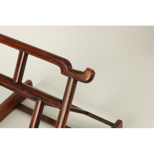 108 - A 19TH CENTURY CHINESE HARDWOOD PORTABLE BOOKREST/EASEL of angular openwork pagoda-top design (21cm ... 