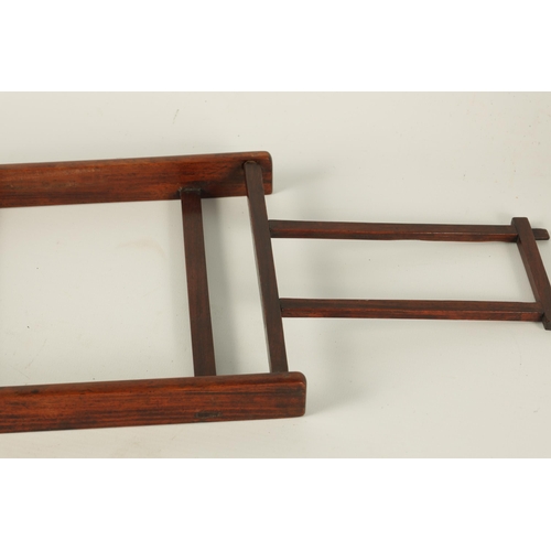 108 - A 19TH CENTURY CHINESE HARDWOOD PORTABLE BOOKREST/EASEL of angular openwork pagoda-top design (21cm ... 