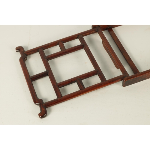 108 - A 19TH CENTURY CHINESE HARDWOOD PORTABLE BOOKREST/EASEL of angular openwork pagoda-top design (21cm ... 