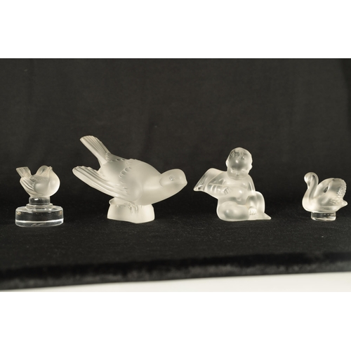 11 - A COLLECTION OF FOUR LALIQUE FRANCE FROSTED GLASS SCULPTURES comprising of a Swallow, Swan Wren and ... 