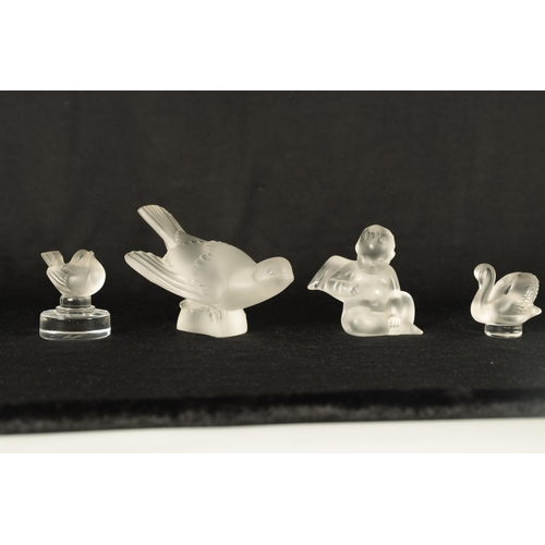 11 - A COLLECTION OF FOUR LALIQUE FRANCE FROSTED GLASS SCULPTURES comprising of a Swallow, Swan Wren and ... 