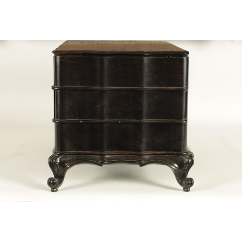 117 - A GOOD 19TH CENTURY ANGLO INDIAN EBONY MINIATURE COMMODE of all-round wavey edge form with moulded d... 