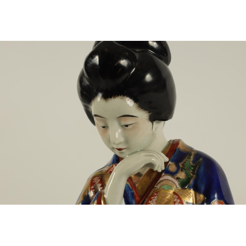 118 - A JAPANESE ARITA STANDING FIGURE OF A GEISHA dressed in finely decorated royal blue costume highligh... 