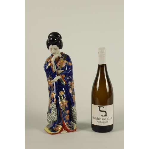 118 - A JAPANESE ARITA STANDING FIGURE OF A GEISHA dressed in finely decorated royal blue costume highligh... 