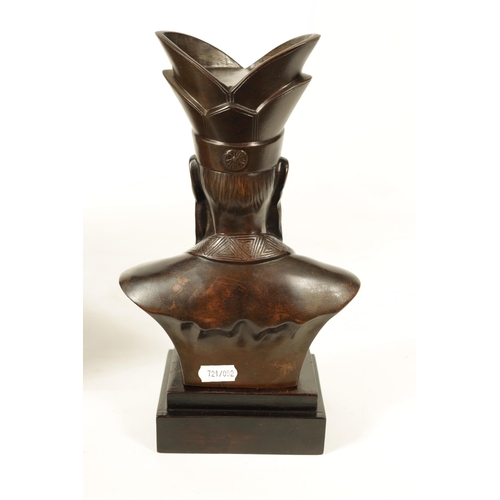 119 - A LATE 19TH CENTURY JAPANESE PATINATED BRONZE BUST ON STAND modelled as an Emperor mounted on an ebo... 