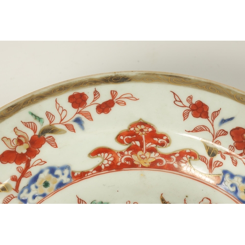 121 - TWO 18TH CENTURY CHINESE POLYCHROME DISHES with flower spray and gilt decoration. (22.5cm diameter )