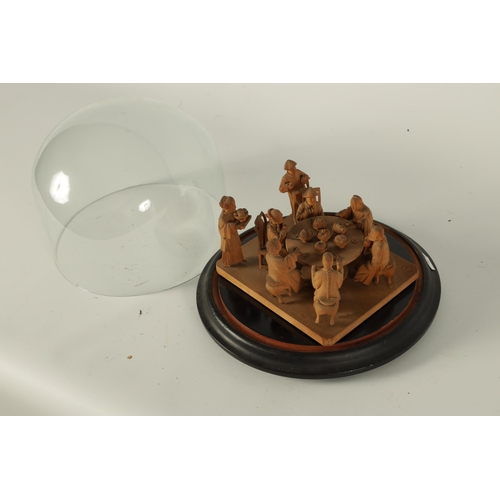 128 - A 19TH CENTURY CHINESE BOXWOOD CARVED FIGURE GROUP UNDER GLASS DOME depicting a family eating around... 