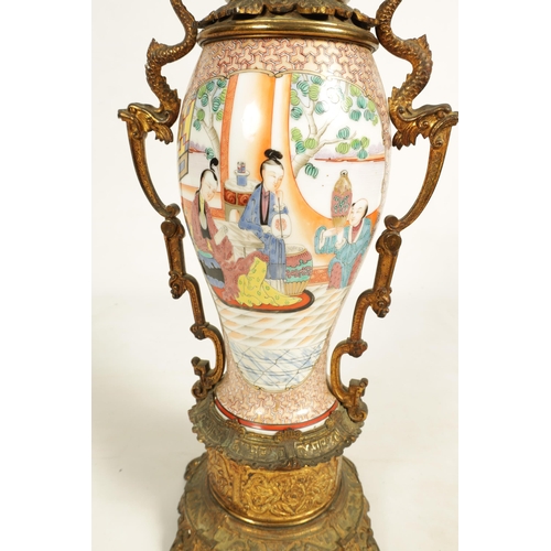 133 - A 19TH CENTURY CHINESE FAMILLE ROSE VASE LAMP with ormolu mounted oil lamp and figural scene to the ... 