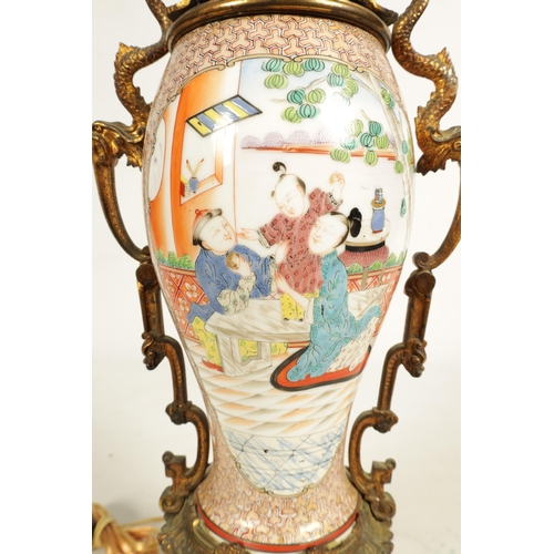 133 - A 19TH CENTURY CHINESE FAMILLE ROSE VASE LAMP with ormolu mounted oil lamp and figural scene to the ... 