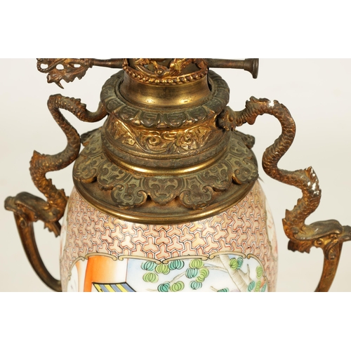 133 - A 19TH CENTURY CHINESE FAMILLE ROSE VASE LAMP with ormolu mounted oil lamp and figural scene to the ... 