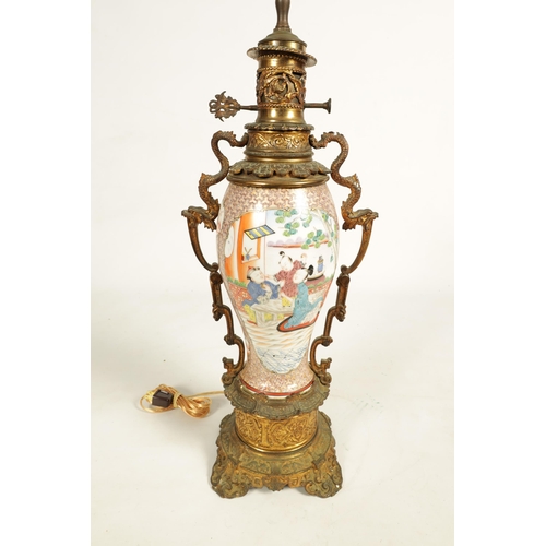 133 - A 19TH CENTURY CHINESE FAMILLE ROSE VASE LAMP with ormolu mounted oil lamp and figural scene to the ... 