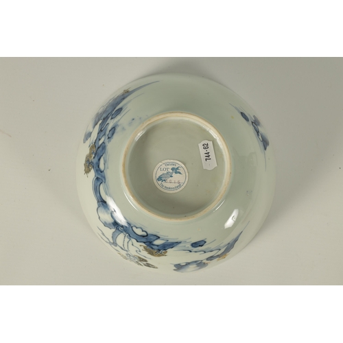 134 - AN 18TH CENTURY CHINESE BLUE AND WHITE FOOTED BOWL FROM THE NANKING CARGO decorated with tree-lined ... 