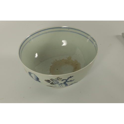 134 - AN 18TH CENTURY CHINESE BLUE AND WHITE FOOTED BOWL FROM THE NANKING CARGO decorated with tree-lined ... 