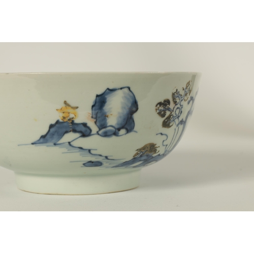 134 - AN 18TH CENTURY CHINESE BLUE AND WHITE FOOTED BOWL FROM THE NANKING CARGO decorated with tree-lined ... 