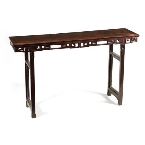 135 - A 19TH CENTURY CHINESE HARDWOOD ALTAR TABLE OF GOOD COLOUR AND PATINA with cleated top above a pierc... 