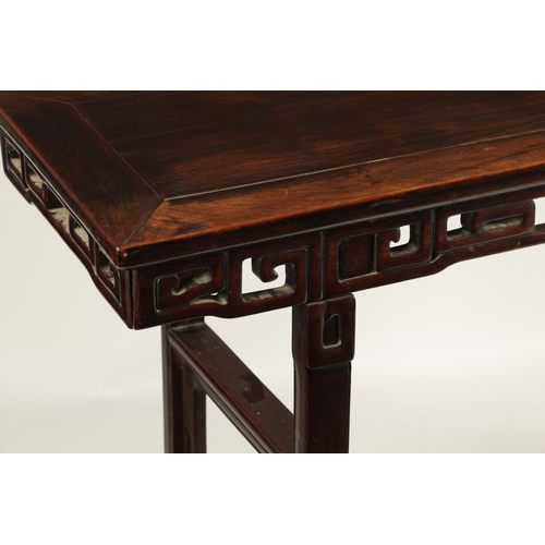 135 - A 19TH CENTURY CHINESE HARDWOOD ALTAR TABLE OF GOOD COLOUR AND PATINA with cleated top above a pierc... 