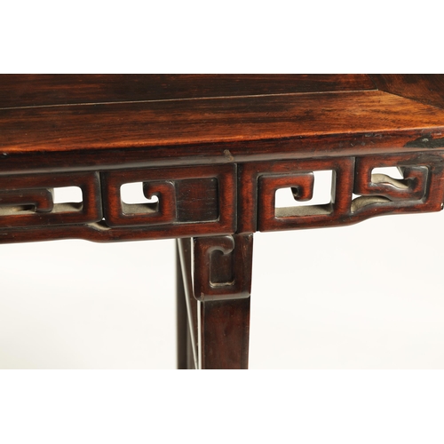 135 - A 19TH CENTURY CHINESE HARDWOOD ALTAR TABLE OF GOOD COLOUR AND PATINA with cleated top above a pierc... 