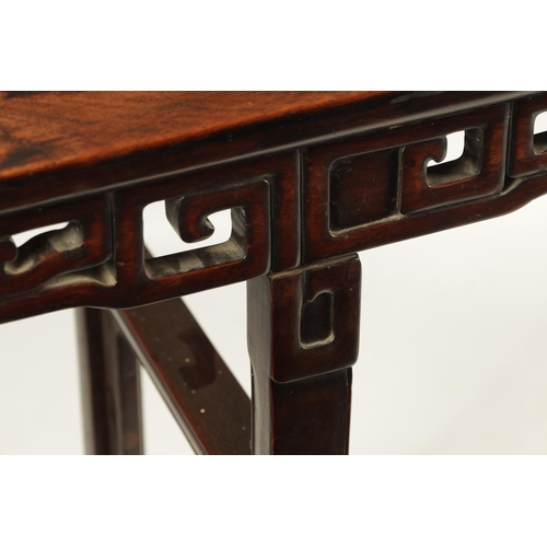 135 - A 19TH CENTURY CHINESE HARDWOOD ALTAR TABLE OF GOOD COLOUR AND PATINA with cleated top above a pierc... 