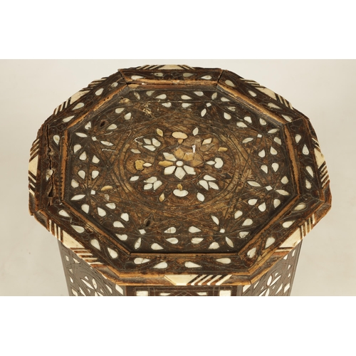 137 - A 19TH CENTURY BONE AND MOTHER OF PEARL INLAID OCCASIONAL TABLE of octagonal shape with arched cut o... 