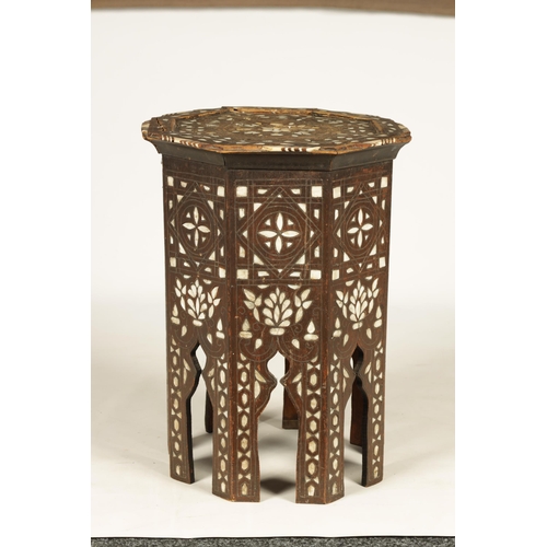 137 - A 19TH CENTURY BONE AND MOTHER OF PEARL INLAID OCCASIONAL TABLE of octagonal shape with arched cut o... 