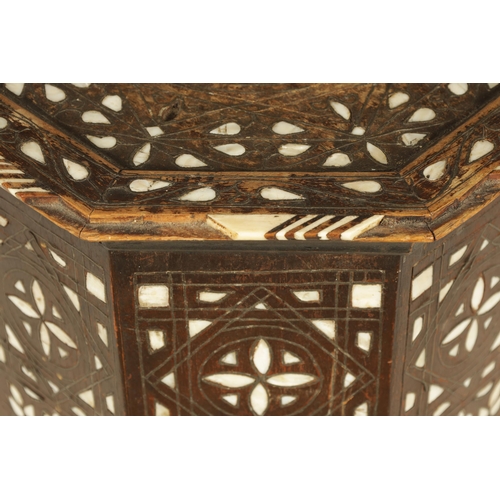 137 - A 19TH CENTURY BONE AND MOTHER OF PEARL INLAID OCCASIONAL TABLE of octagonal shape with arched cut o... 