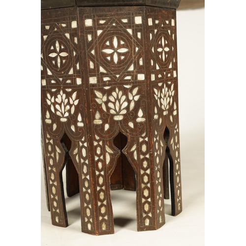 137 - A 19TH CENTURY BONE AND MOTHER OF PEARL INLAID OCCASIONAL TABLE of octagonal shape with arched cut o... 